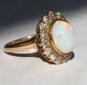  14K gold, Opal & Diamond halo on a ring,Nobel Antique jewelry Store, Santa Monica. Made in America.